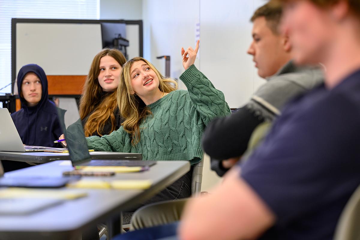 Political science students in discussion during a class
