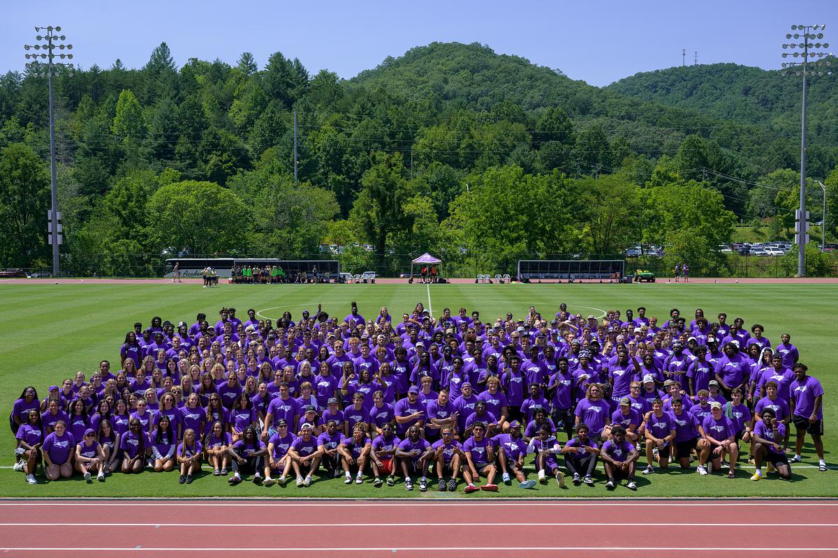 Three Graduating Students Smiling and Enjoying Their Accomplishments