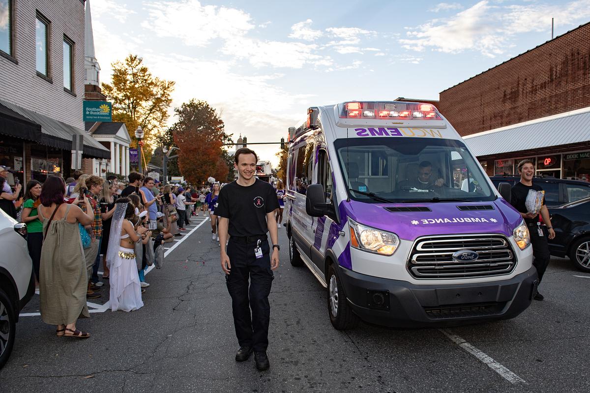 EMS staff and the WCU ambulance walk in the Homecoming Parade