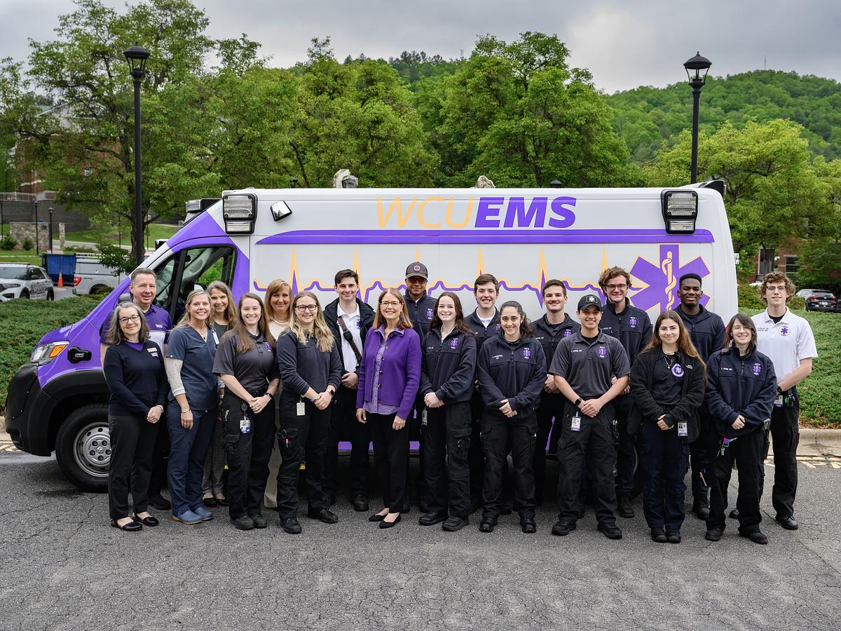 EMS Staff stand next to the Ģ������ƵAmbulance