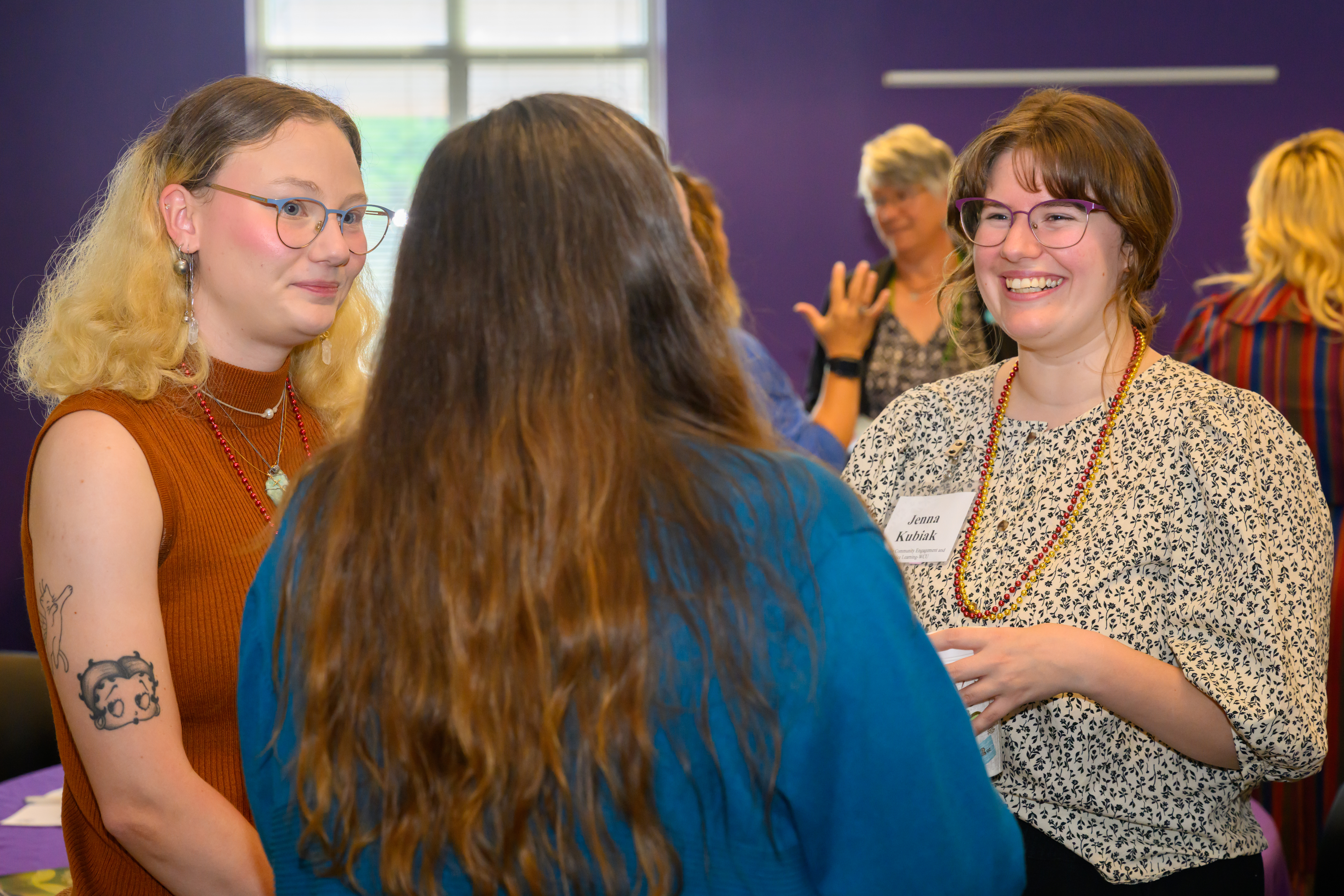 Group of women talking and smiling together