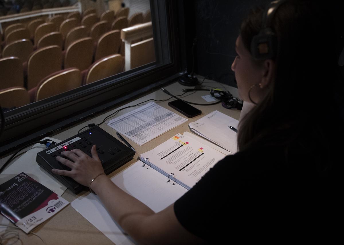 Olivia Ramos at a control board monitoring a show