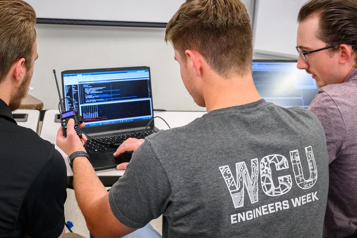 Engineering students work together on a project