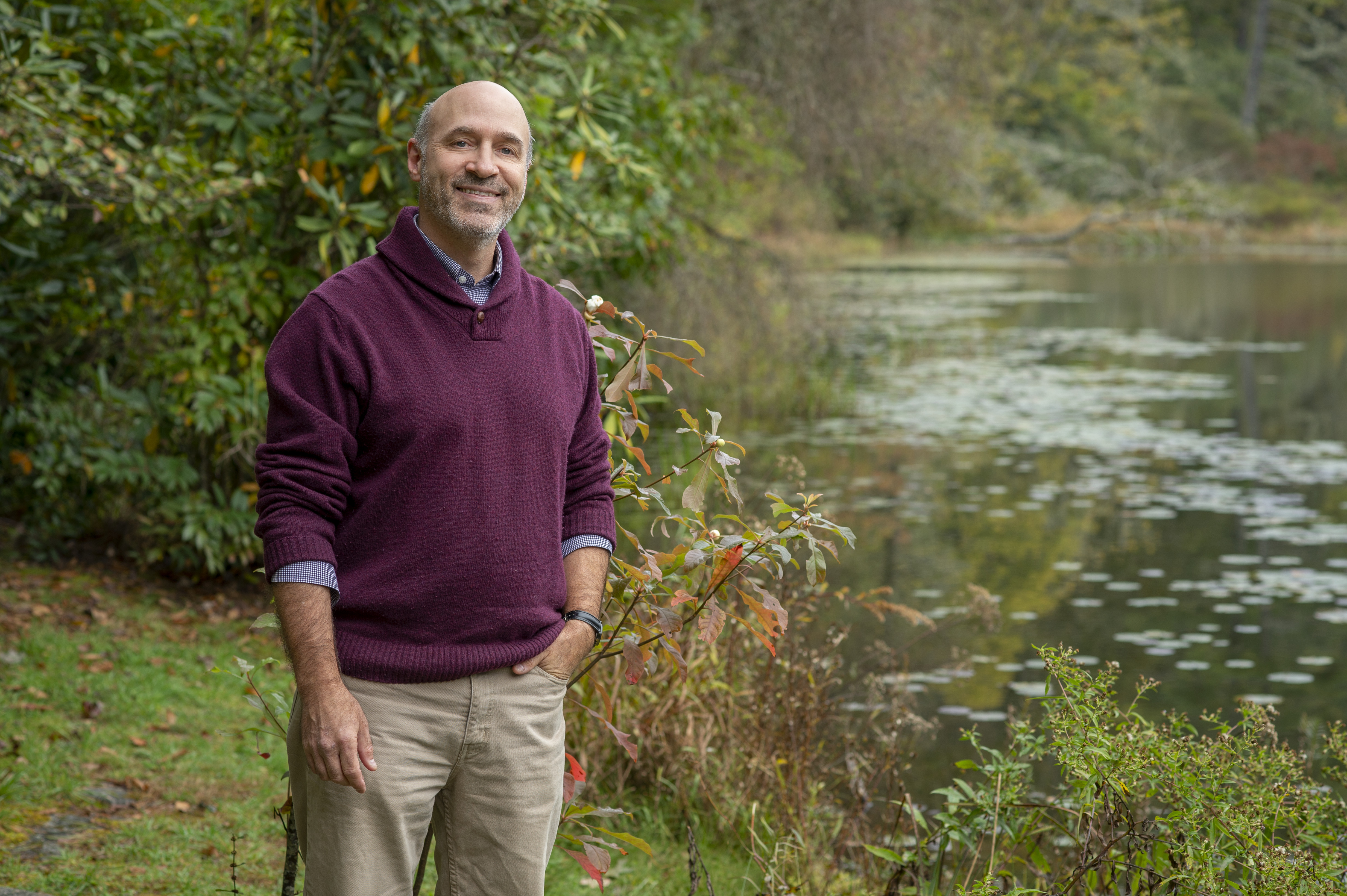 Jim Costa stands near the lake at Highlands Biological Station