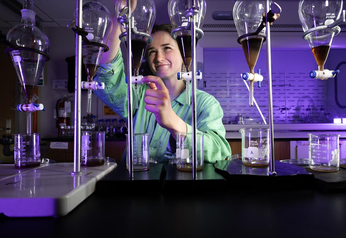 Student works with equipment in a science lab
