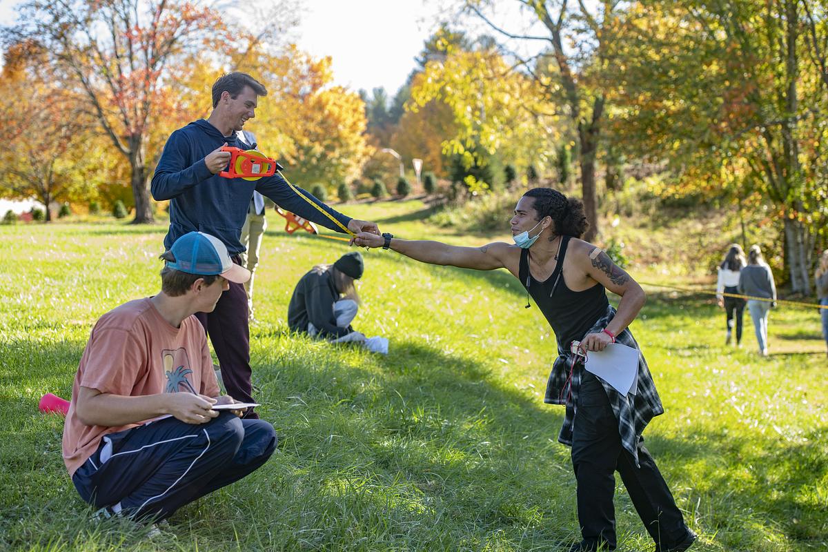 Environmental Science students working outdoors together in a field