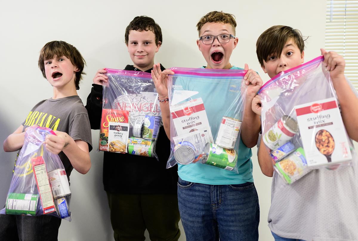Four Catamount School students looking excited