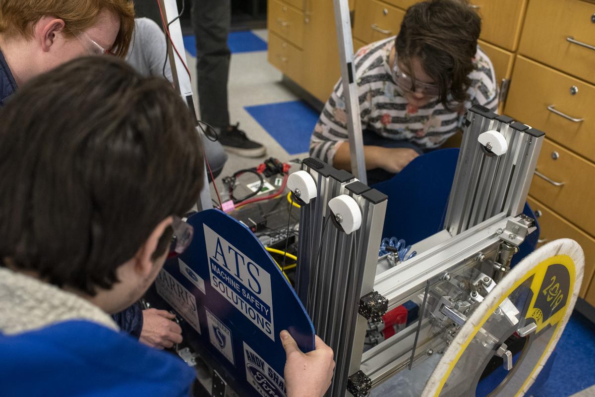 K12 students building a robot