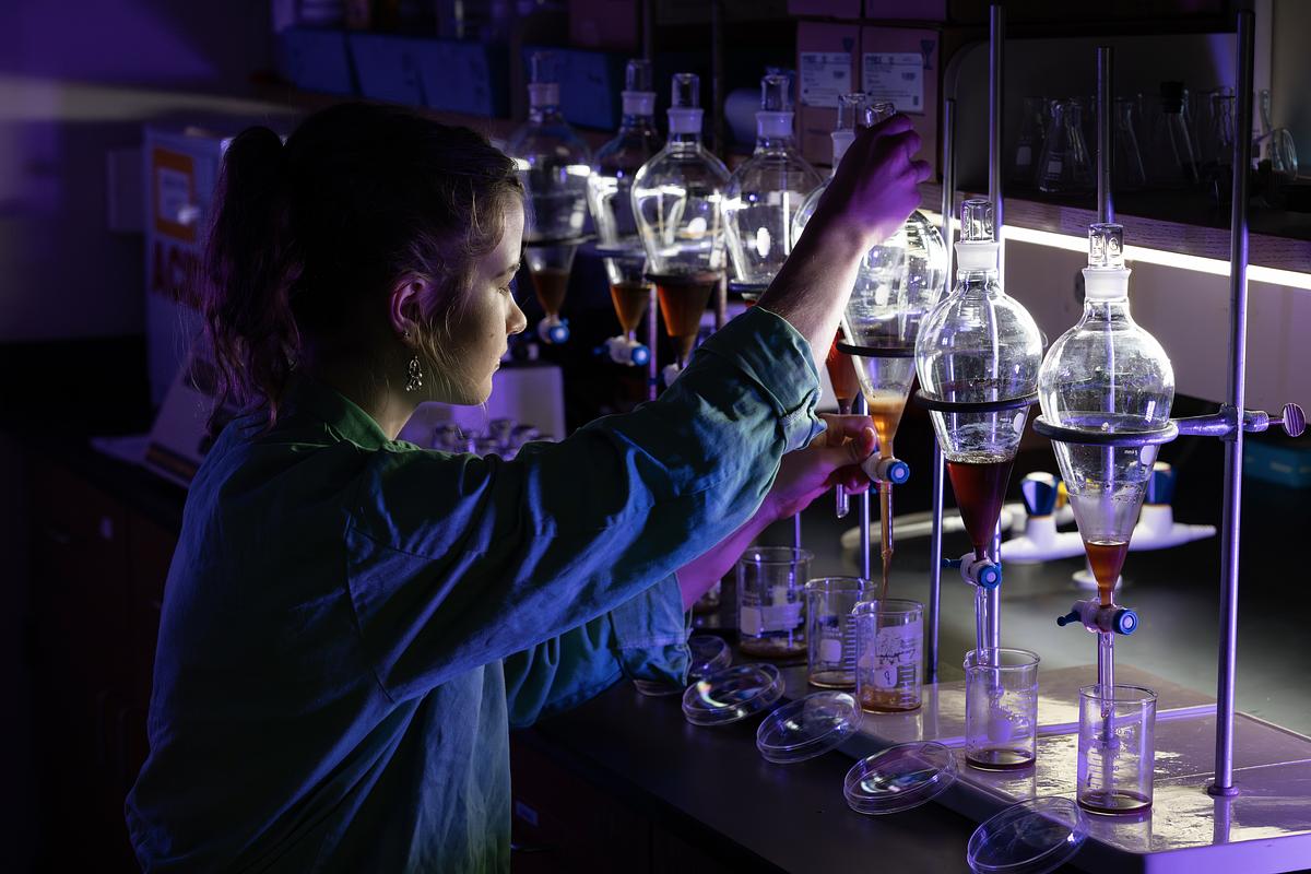 Chemistry student working with equipment in a lab