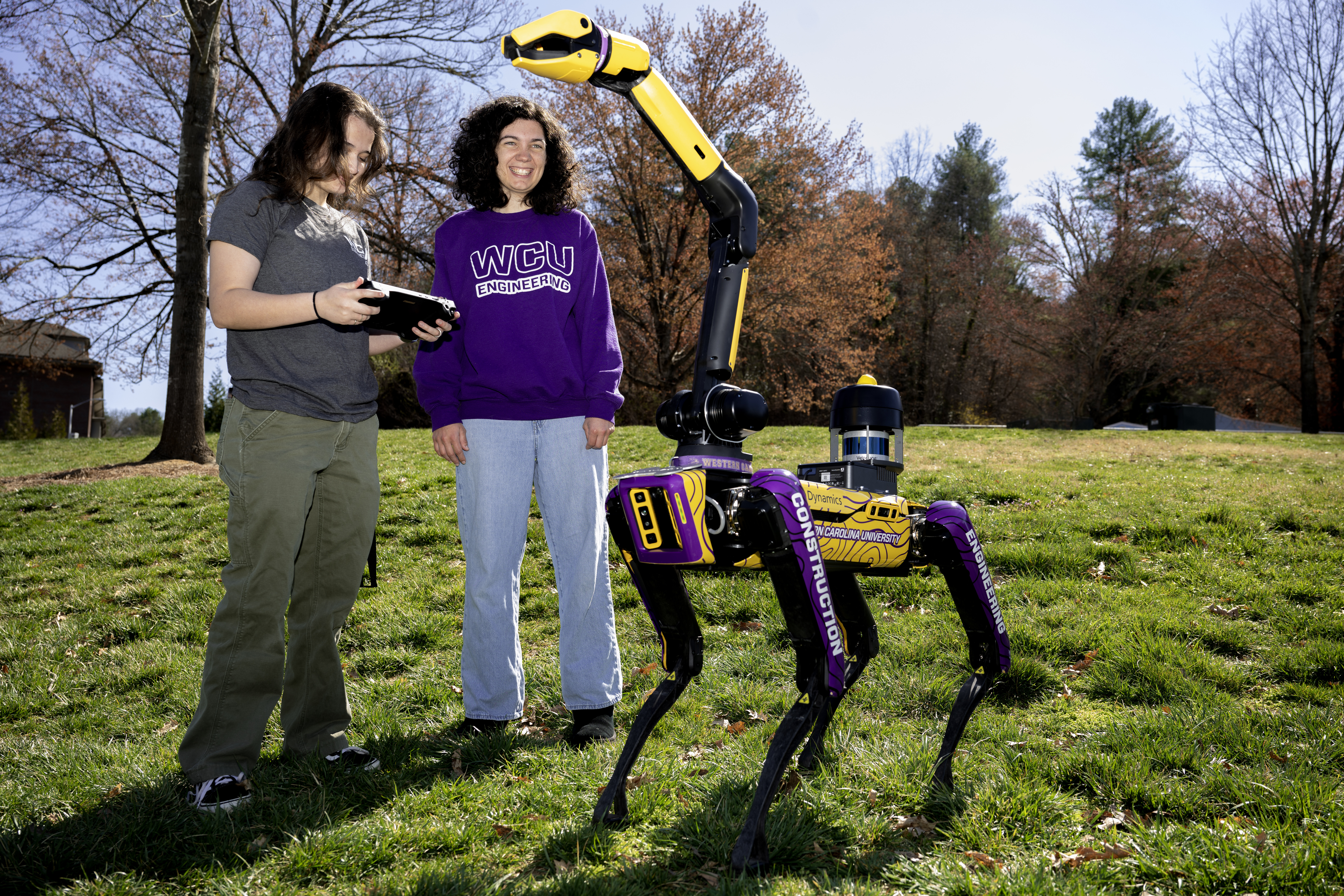 students work with robot dog