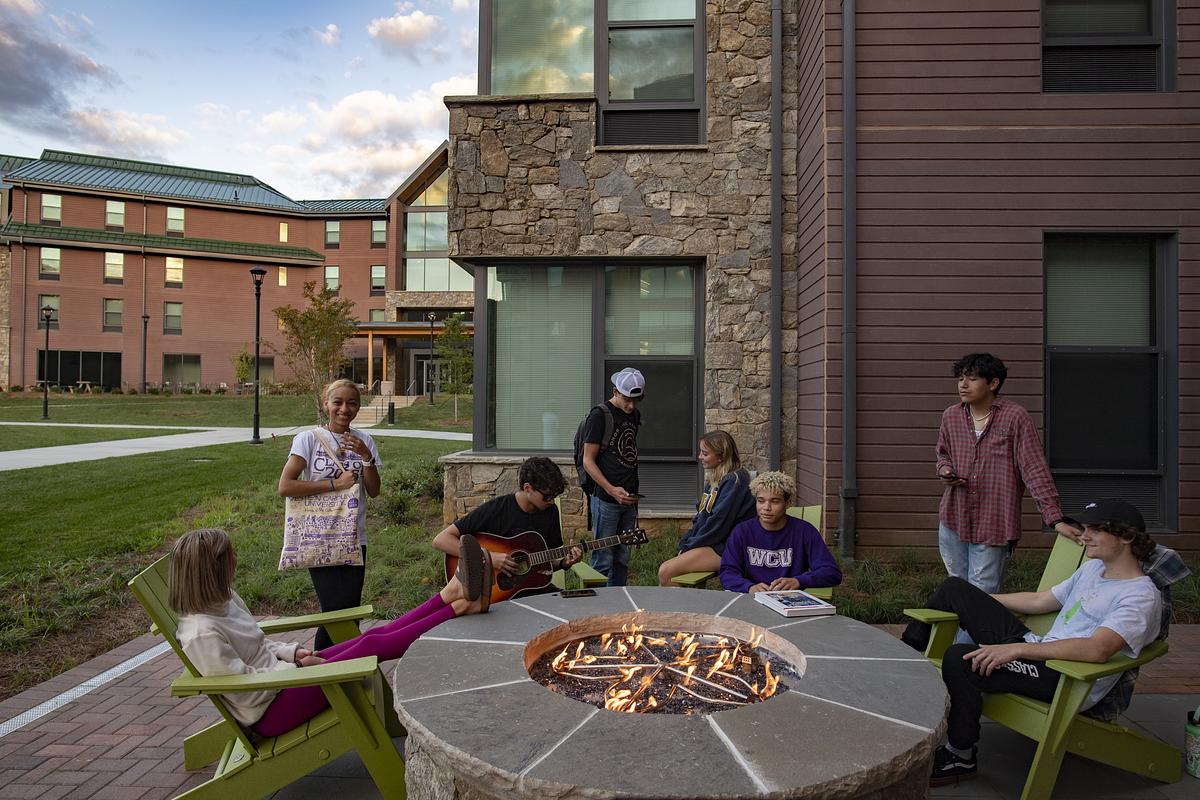 students around camp fire