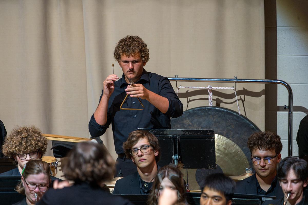 Comprehensive student practitioner working with a child in class