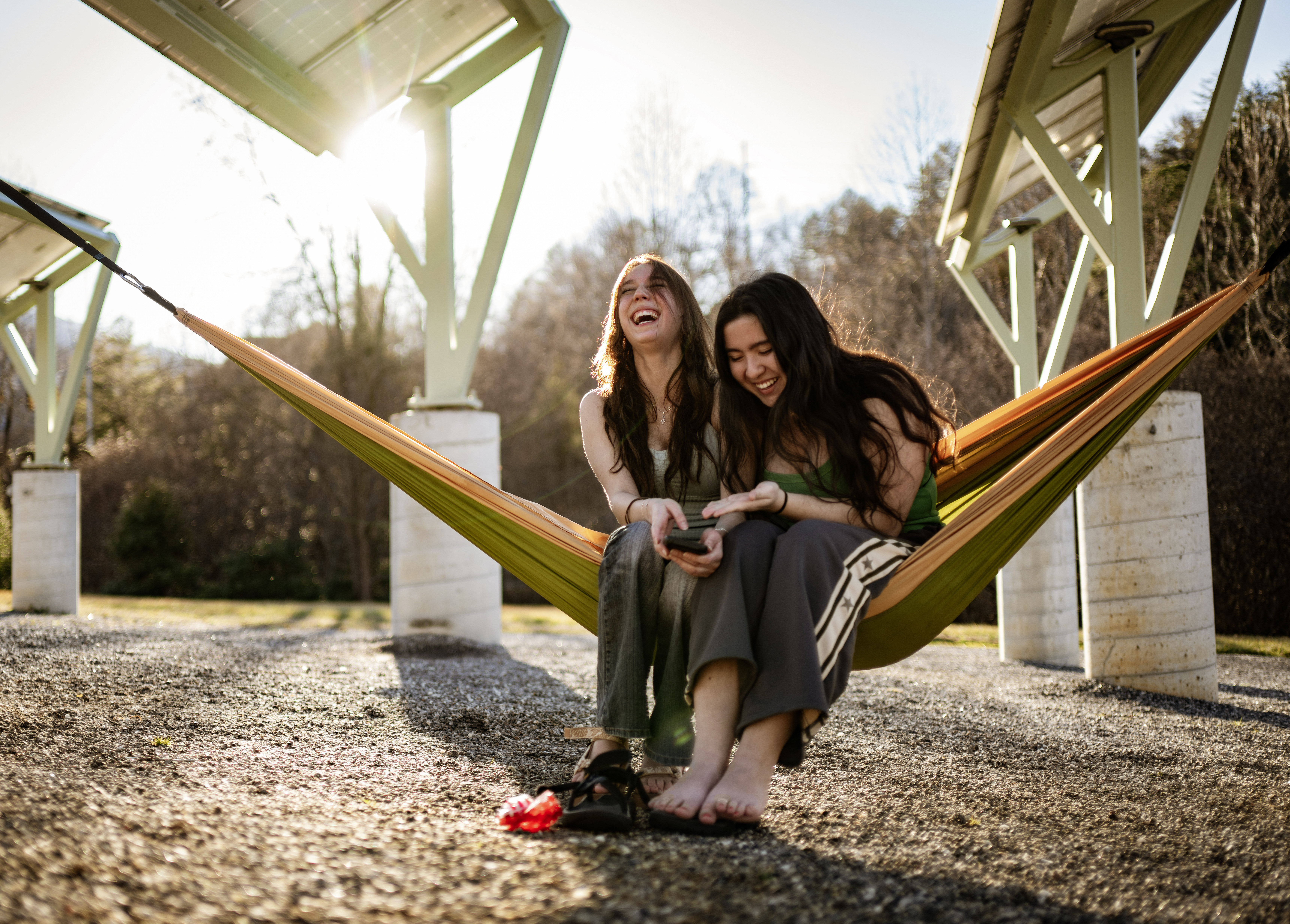 Girls laughing in hammock