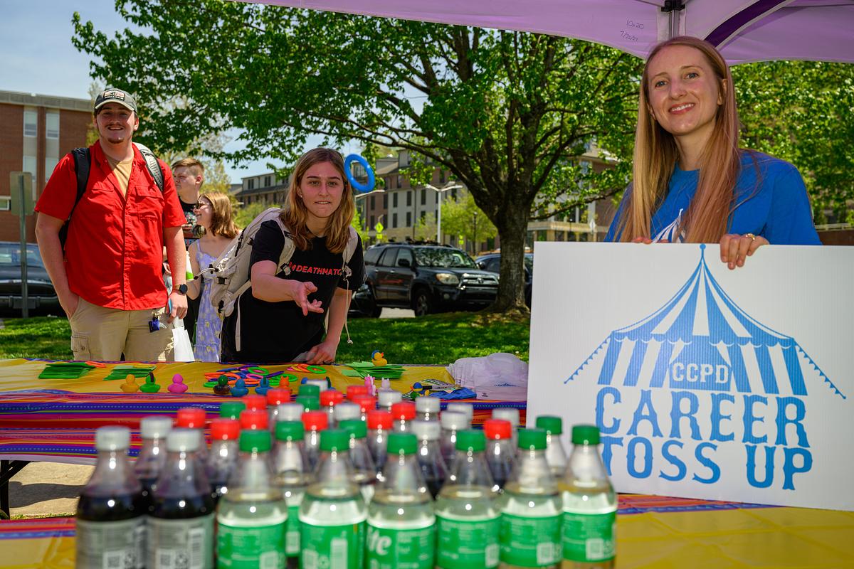 Picture of a ring toss carnival game with a sign that says "Career Toss Up"