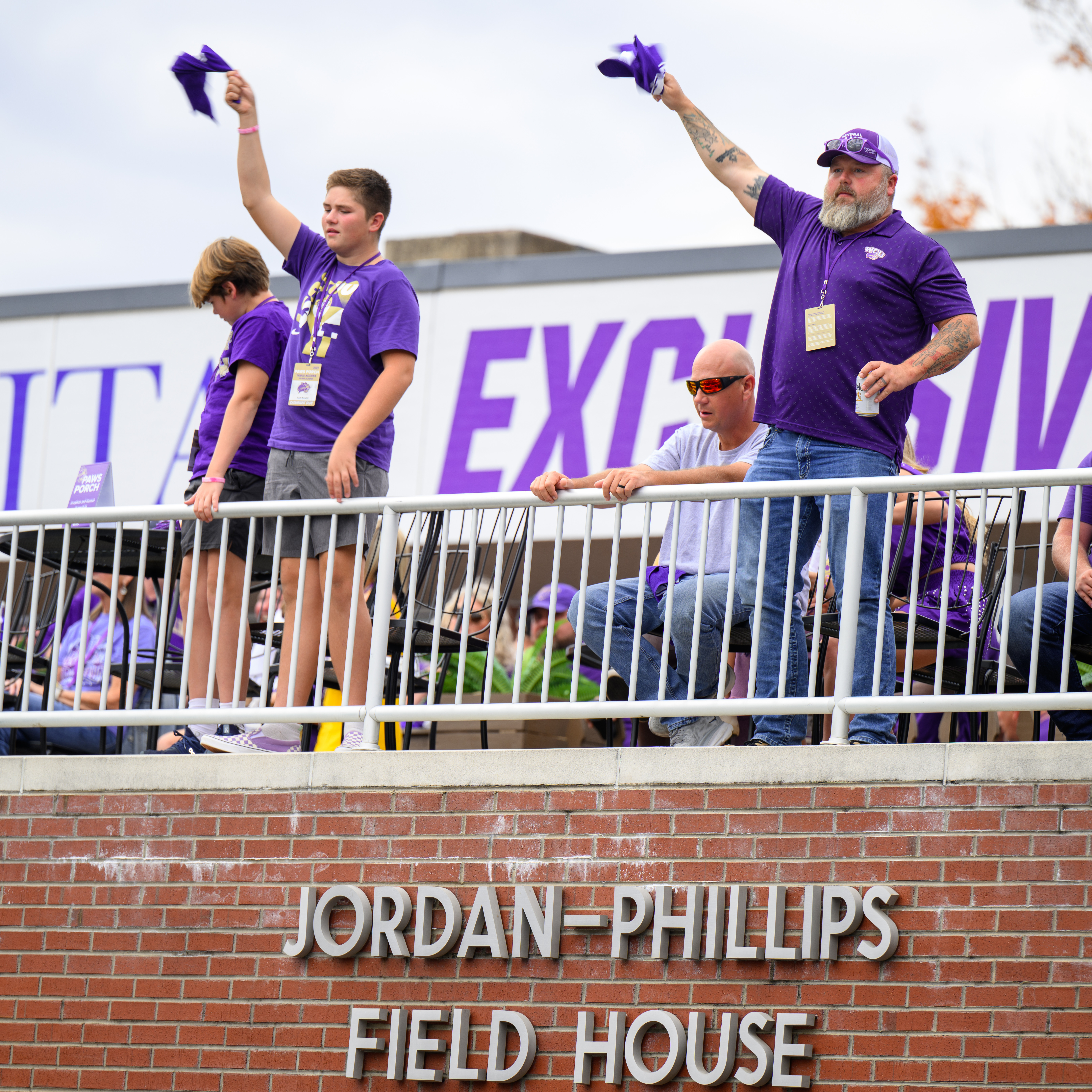 Fans cheer on the Catamount football team from Paws Porch
