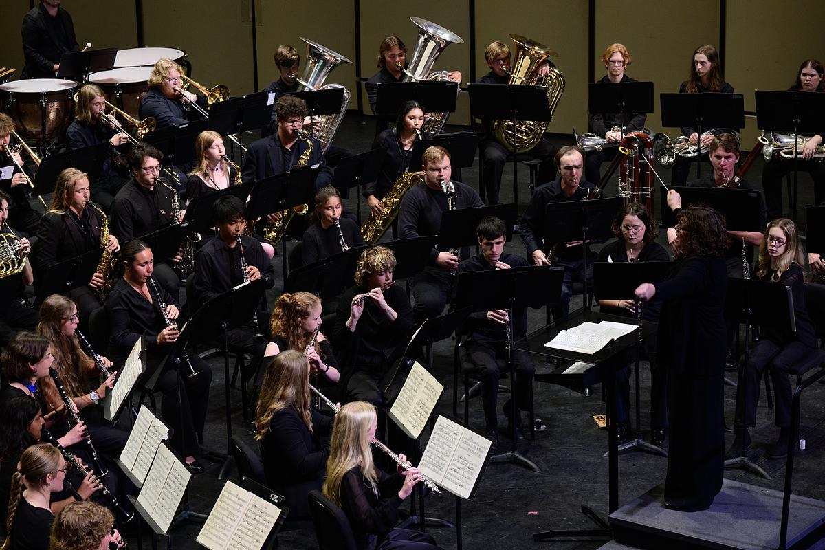 Students playing their instruments during a live performance