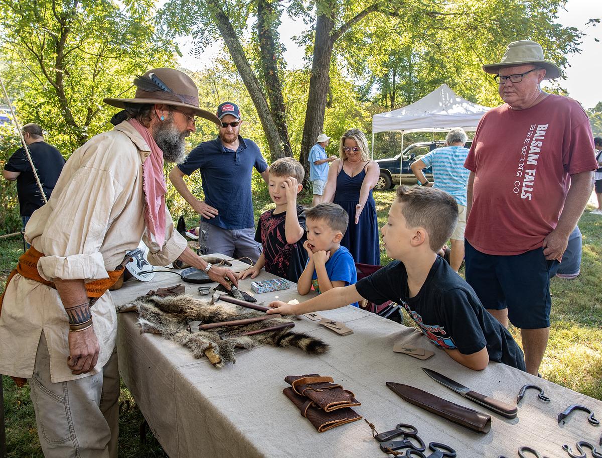 Children and parents looking at various booths at the 2025 Mountain Heritage Festival