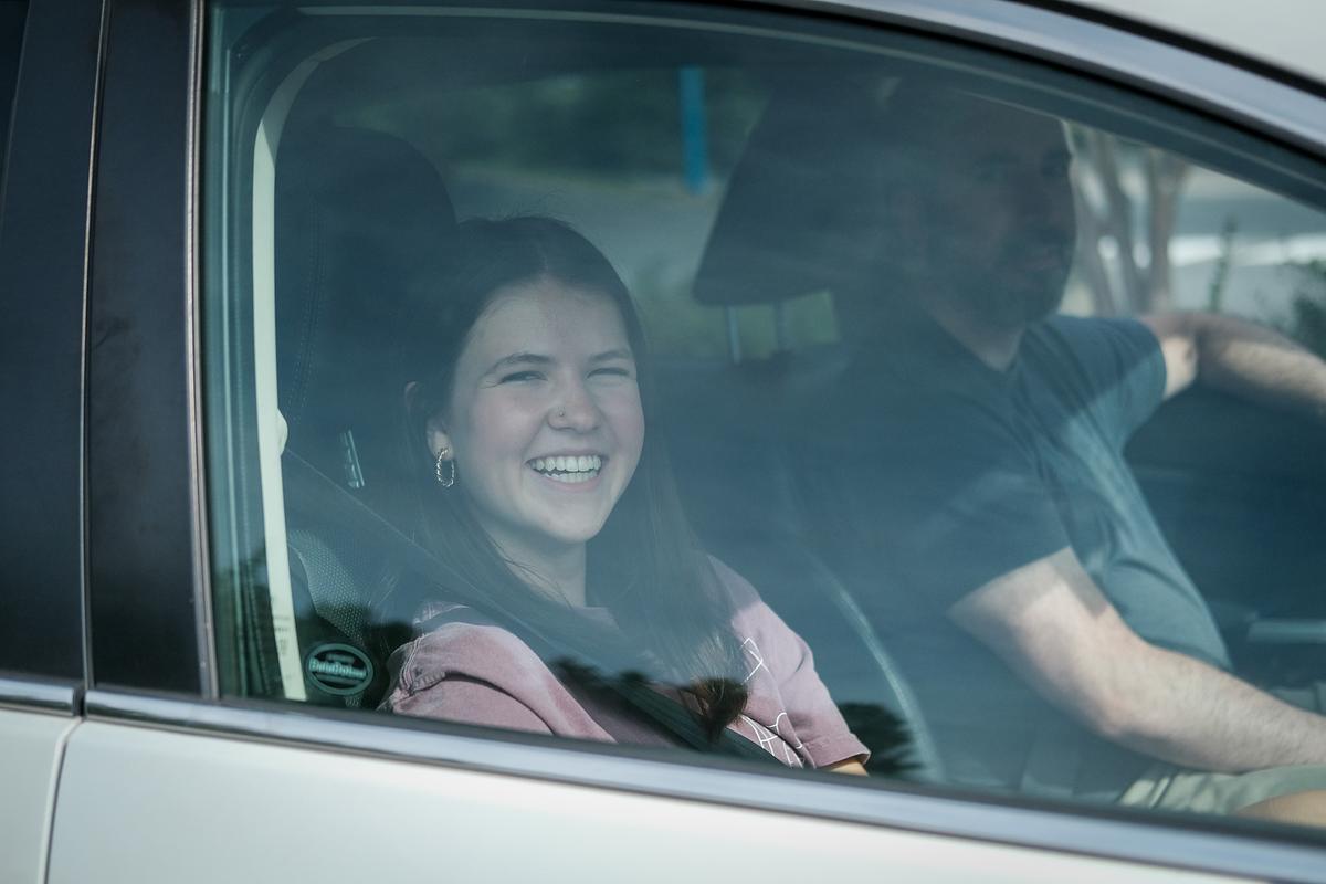 JB driving with passengers at the BTS Anthem