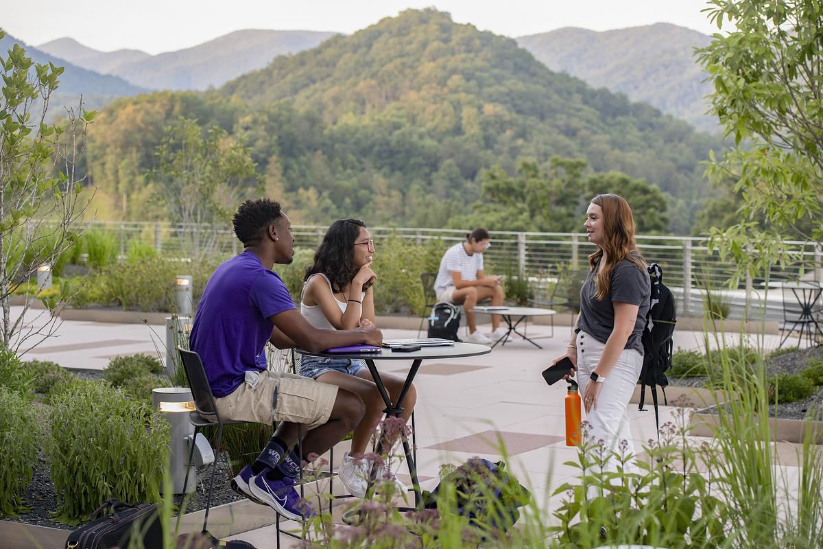 Students sitting on Apodaca Terrace during the day