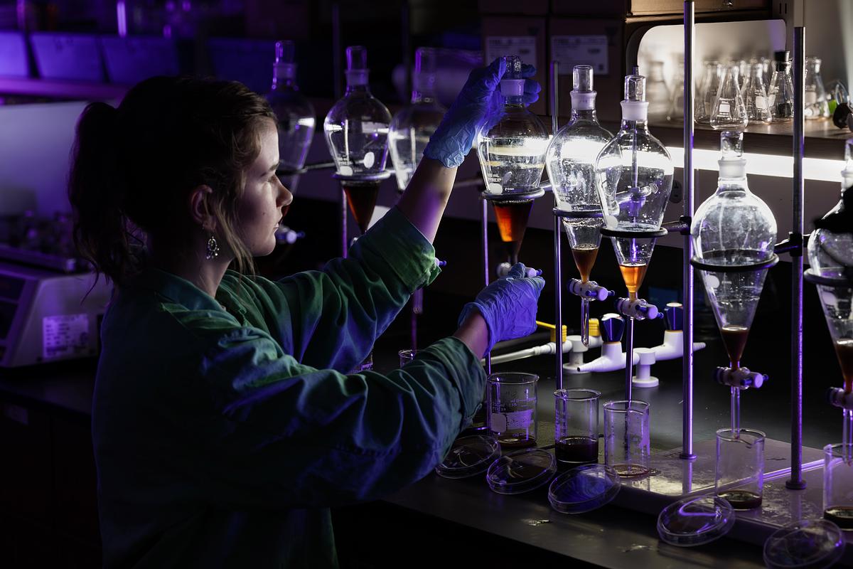 Student works in the lab with chemistry equipment and organic substances being studied