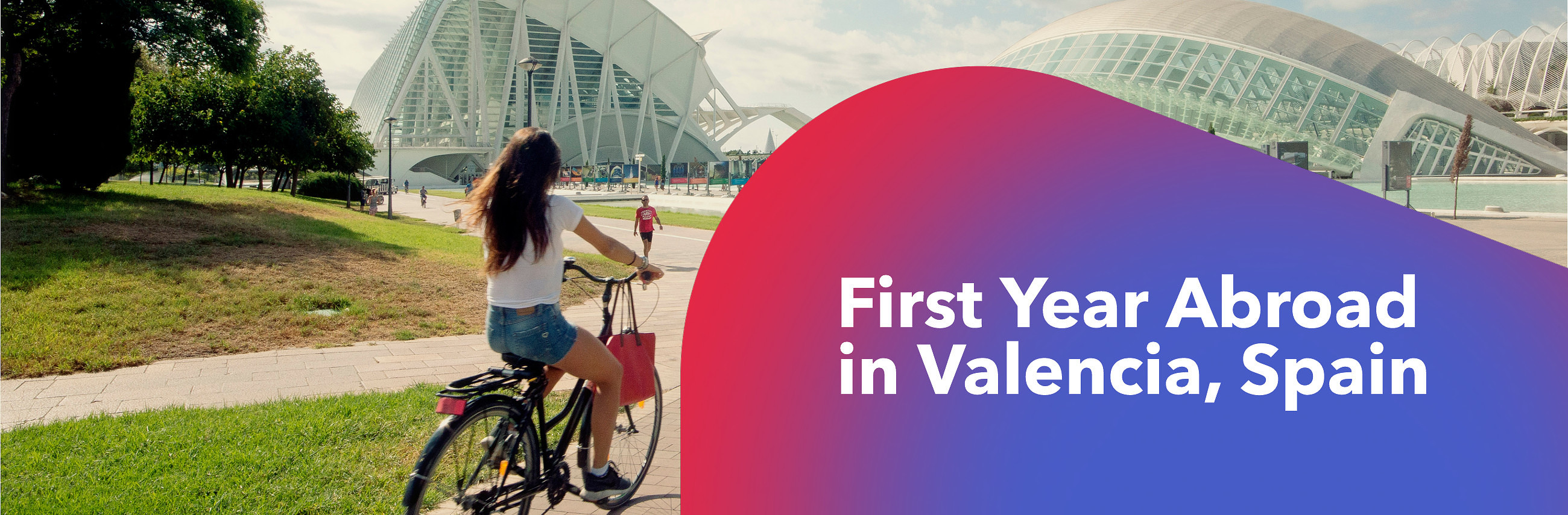 A student rides a bicycle on the Berklee Valencia campus