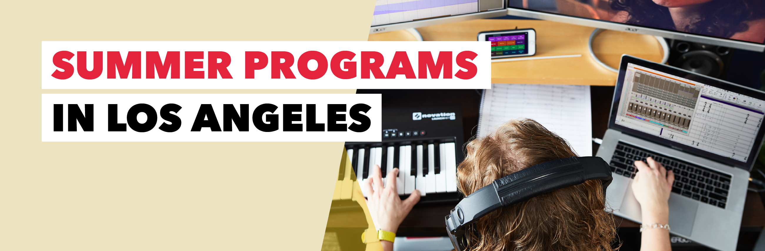 Student with headphones working at a music production setup: keyboard, laptop, and monitors.