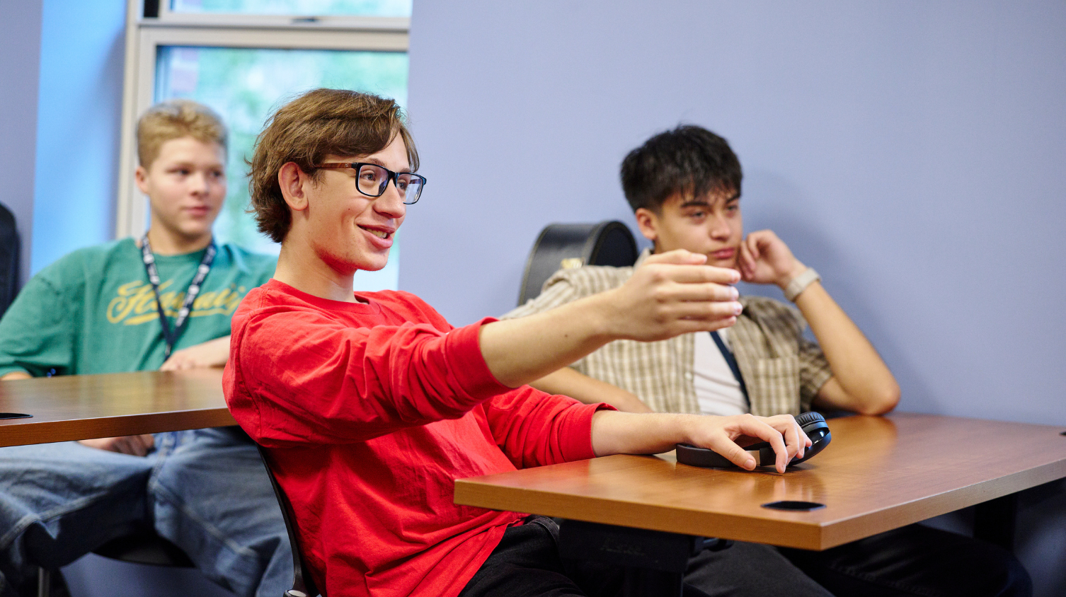 Music business students talking in a classroom