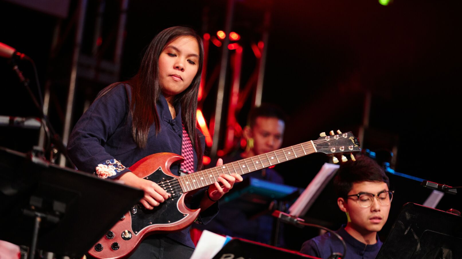 Student playing guitar